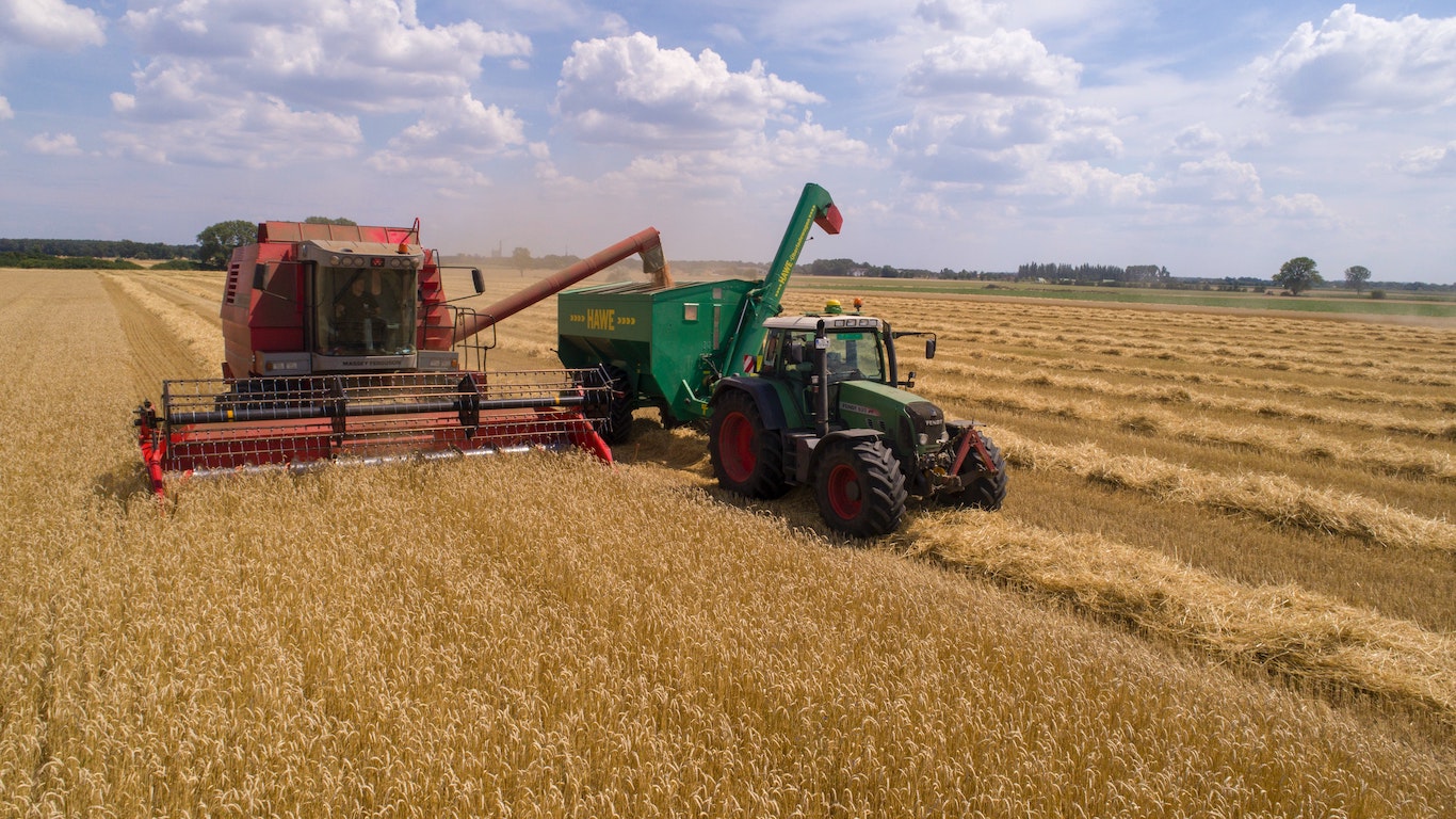 A Grain Harvester and Tractor.